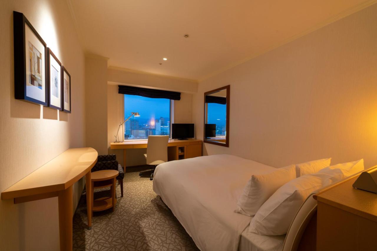Hotel Associa Тоёхаси Экстерьер фото A room at the hotel